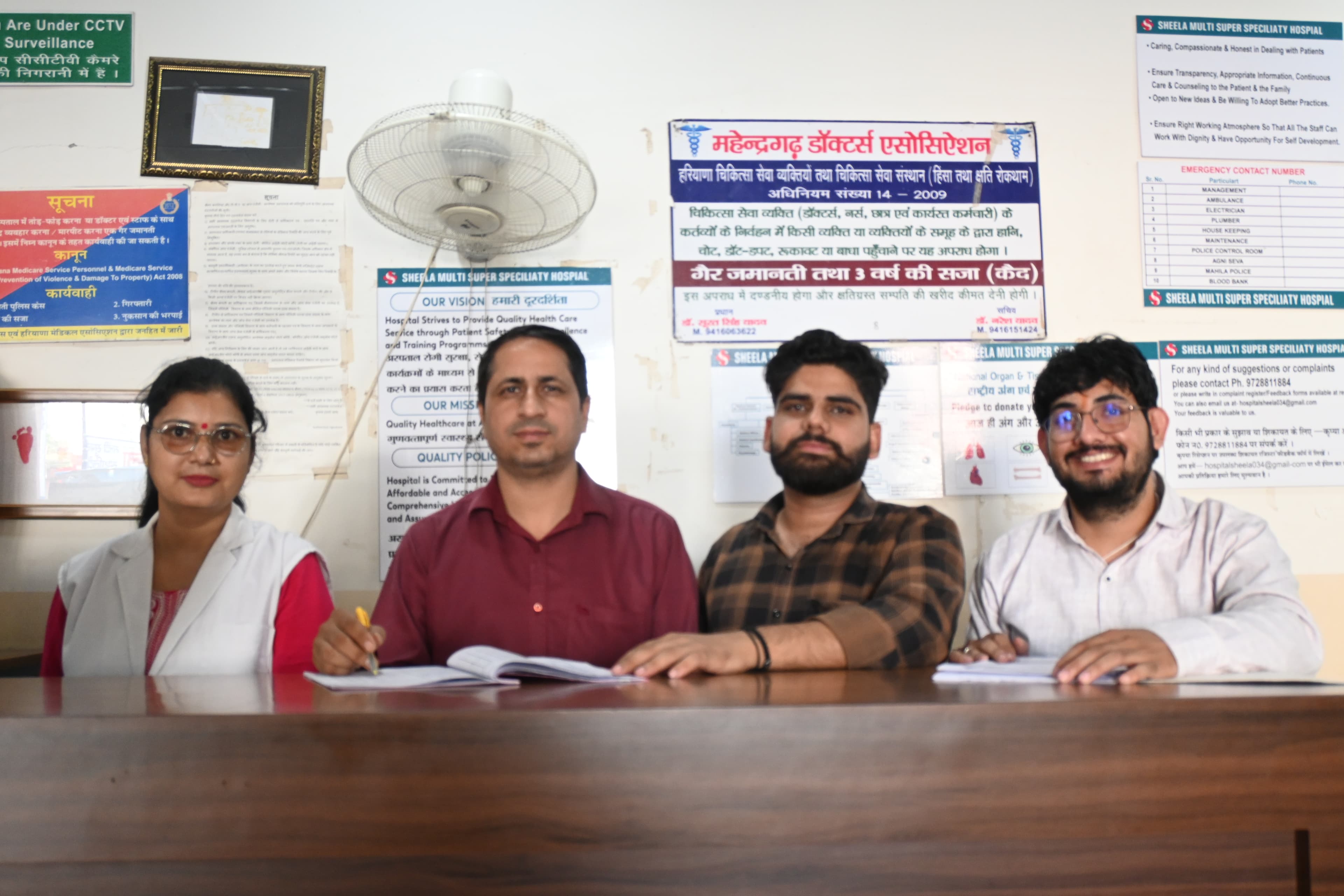 Sheela Hospital's team at the reception desk